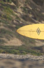 CARA DELEVINGNE in Bikini Top at a Beach in Malibu