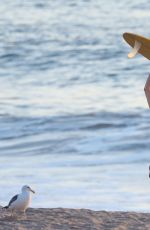CARA DELEVINGNE in Bikini Top at a Beach in Malibu