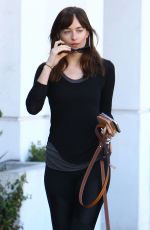DAKOTA JOHNSON Walks Her Dog Out in West Hollywood