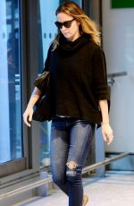 EMILY BLUNT in Ripped Jeans at Heathrow Airport in London