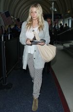 LEANN RIMES Arrives at Los Angeles International Airport