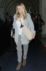 LEANN RIMES Arrives at Los Angeles International Airport