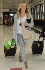 LEANN RIMES Arrives at Los Angeles International Airport