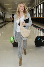 LEANN RIMES Arrives at Los Angeles International Airport