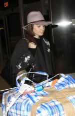 LILY COLLINS at Los Angeles International Airport 0901