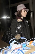 LILY COLLINS at Los Angeles International Airport 0901