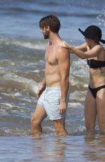 MILEY CYRUS in Bikini and Patrick Schwarzenegger on the Beach in Hawaii 2101