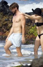 MILEY CYRUS in Bikini and Patrick Schwarzenegger on the Beach in Hawaii 2101