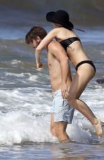 MILEY CYRUS in Bikini and Patrick Schwarzenegger on the Beach in Hawaii 2101