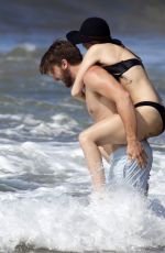 MILEY CYRUS in Bikini and Patrick Schwarzenegger on the Beach in Hawaii 2101