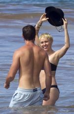 MILEY CYRUS in Bikini and Patrick Schwarzenegger on the Beach in Hawaii 2101