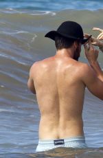 MILEY CYRUS in Bikini and Patrick Schwarzenegger on the Beach in Hawaii 2101