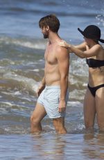MILEY CYRUS in Bikini and Patrick Schwarzenegger on the Beach in Hawaii 2101
