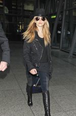 NATALIE DORMER Arrives at Heathrow Airport in London