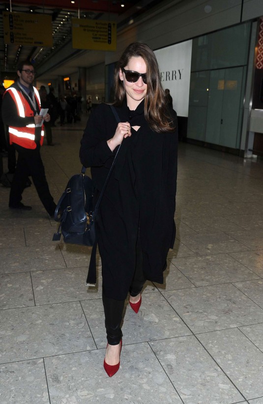 EMILIA CLARKE at Heathrow Airport