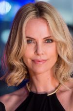 CHARLIZE THERON at The Gunman Premiere in London