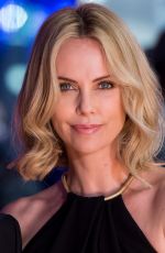CHARLIZE THERON at The Gunman Premiere in London