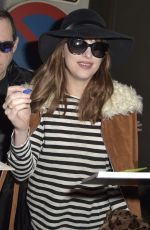 DAKOTA JOHNSON at Tegel Airport in Berlin