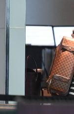 EVA MENDES Arrives at JFK Airport in New York 2002