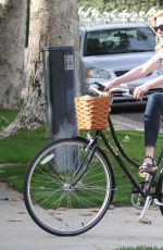 KIRSTEN DUNST Riding a Bike Out in Los Angeles