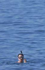 OLIVIA WILDE in Bikini Paddleboarding in Maui
