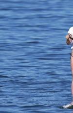 OLIVIA WILDE in Bikini Paddleboarding in Maui