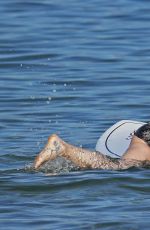 OLIVIA WILDE in Bikini Paddleboarding in Maui