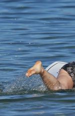 OLIVIA WILDE in Bikini Paddleboarding in Maui