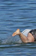 OLIVIA WILDE in Bikini Paddleboarding in Maui