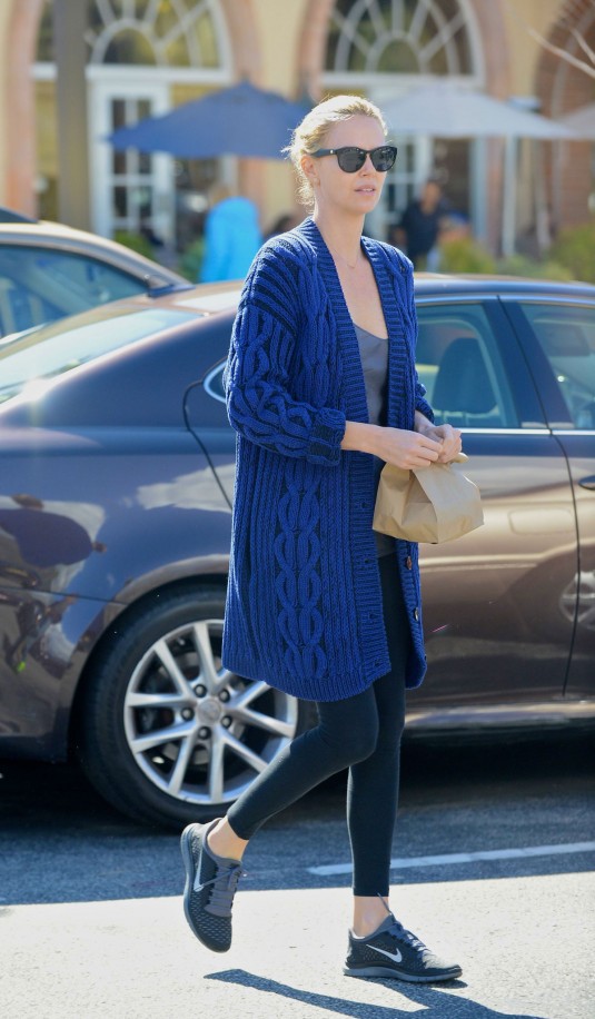 CHARLIZE THERON leaves Coogies Beach Cafe