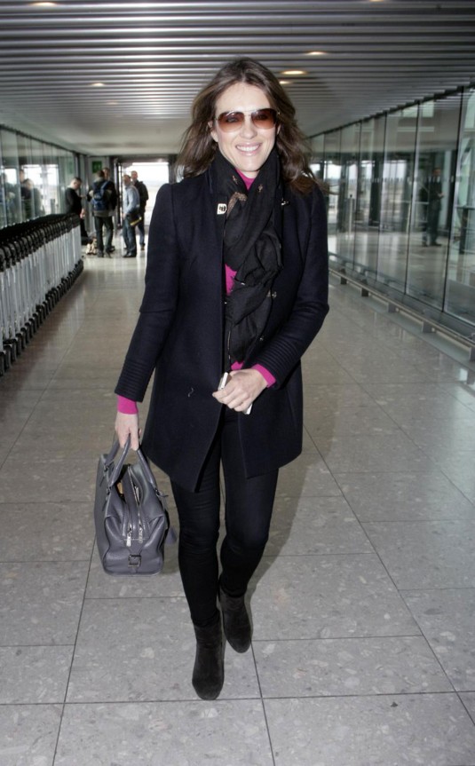 ELIZABETH HURLEY Arrives at Heathrow Airport