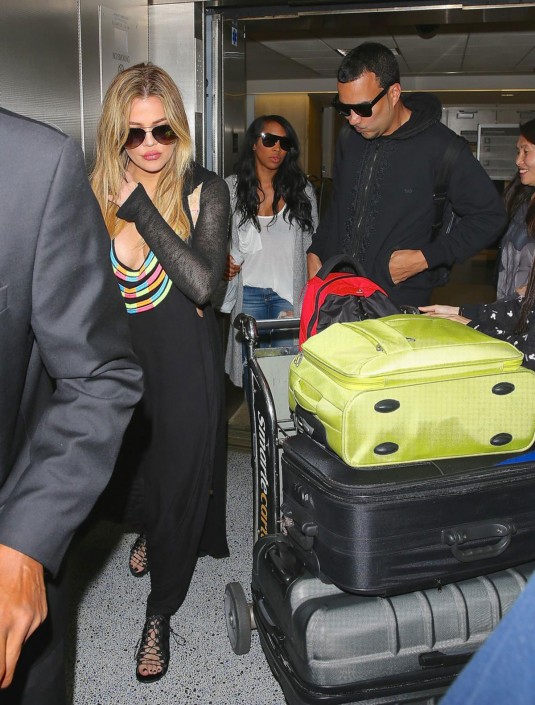 KHLOE KARDASHIAN and French Montana in Florida