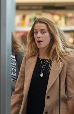 AMBER HEARD at Heathrow Airport in London