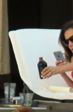 CAROLINE FLACK in Bikini at a Hotel Pool in Los Angeles