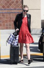 DAKOTA FANNING Arrives at Burbank Airport in Los Angeles