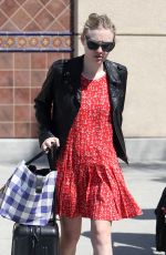 DAKOTA FANNING Arrives at Burbank Airport in Los Angeles