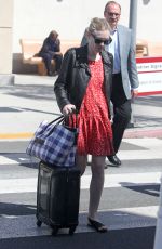 DAKOTA FANNING Arrives at Burbank Airport in Los Angeles