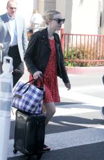 DAKOTA FANNING Arrives at Burbank Airport in Los Angeles