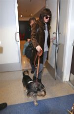 DAKOTA JOHNSON and Her Dog Arrives at Los Angeles International Airport