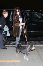 DAKOTA JOHNSON and Her Dog Arrives at Los Angeles International Airport