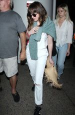 DAKOTA JOHNSON Arrives at Los Angeles International Airport 2103