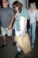 DAKOTA JOHNSON Arrives at Los Angeles International Airport 2103