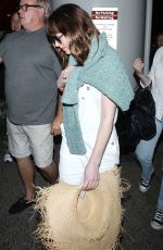 DAKOTA JOHNSON Arrives at Los Angeles International Airport 2103