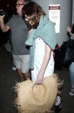 DAKOTA JOHNSON Arrives at Los Angeles International Airport 2103