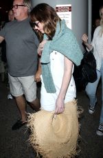 DAKOTA JOHNSON Arrives at Los Angeles International Airport 2103