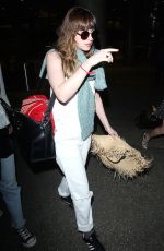 DAKOTA JOHNSON Arrives at Los Angeles International Airport 2103