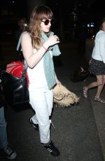 DAKOTA JOHNSON Arrives at Los Angeles International Airport 2103