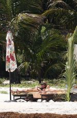DAKOTA JOHNSON in Bikinia at a Beach in Cancun