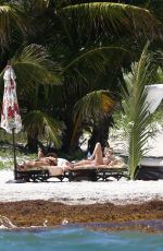 DAKOTA JOHNSON in Bikinia at a Beach in Cancun