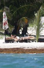 DAKOTA JOHNSON in Bikinia at a Beach in Cancun